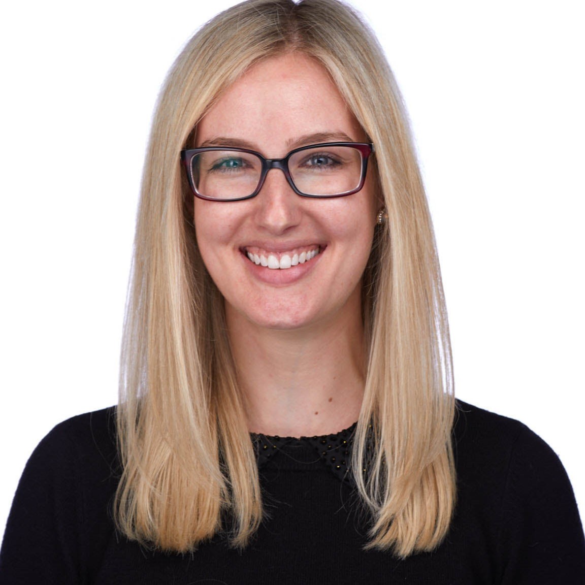 Young woman professor with long blond hair and glasses